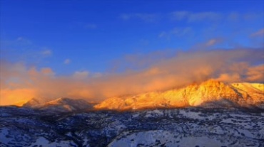 雪山云雾妖娆阳光照耀山体发光视频素材