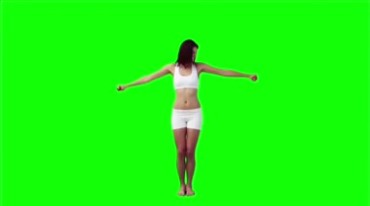 真人美女用小哑铃锻炼身体健身绿布抠像特效视频素材