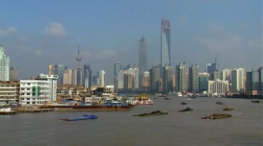 上海黄浦江货船航行高楼建筑群远景实拍视频素材