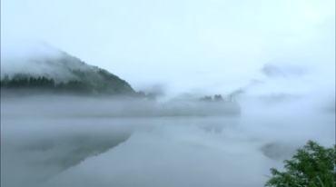 山林之间山脚雾气围绕云雾环绕宛如仙境视频素材