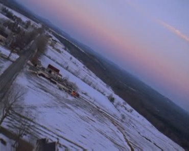 航拍冬天的村庄俯拍白雪覆盖的农田视频素材