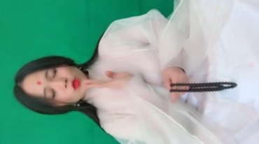 白衣少女唱歌经文绿布抠像后期特效视频素材