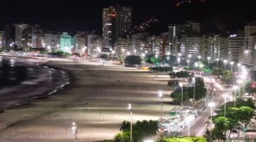 夜晚的城市沙滩华灯初上夜景延时视频素材