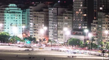 夜晚的城市沙滩华灯初上夜景延时视频素材